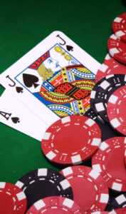 black jack cards with chips